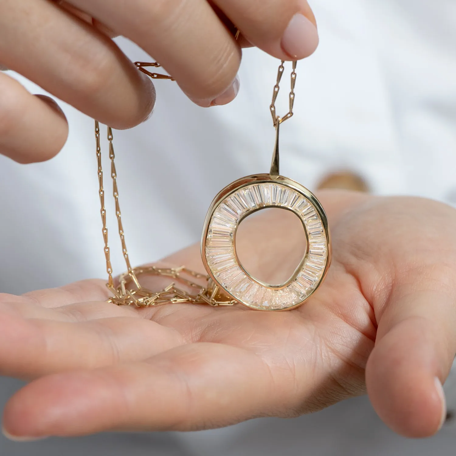 Baguette Diamond Necklace with a Fluid Sphere Pendant