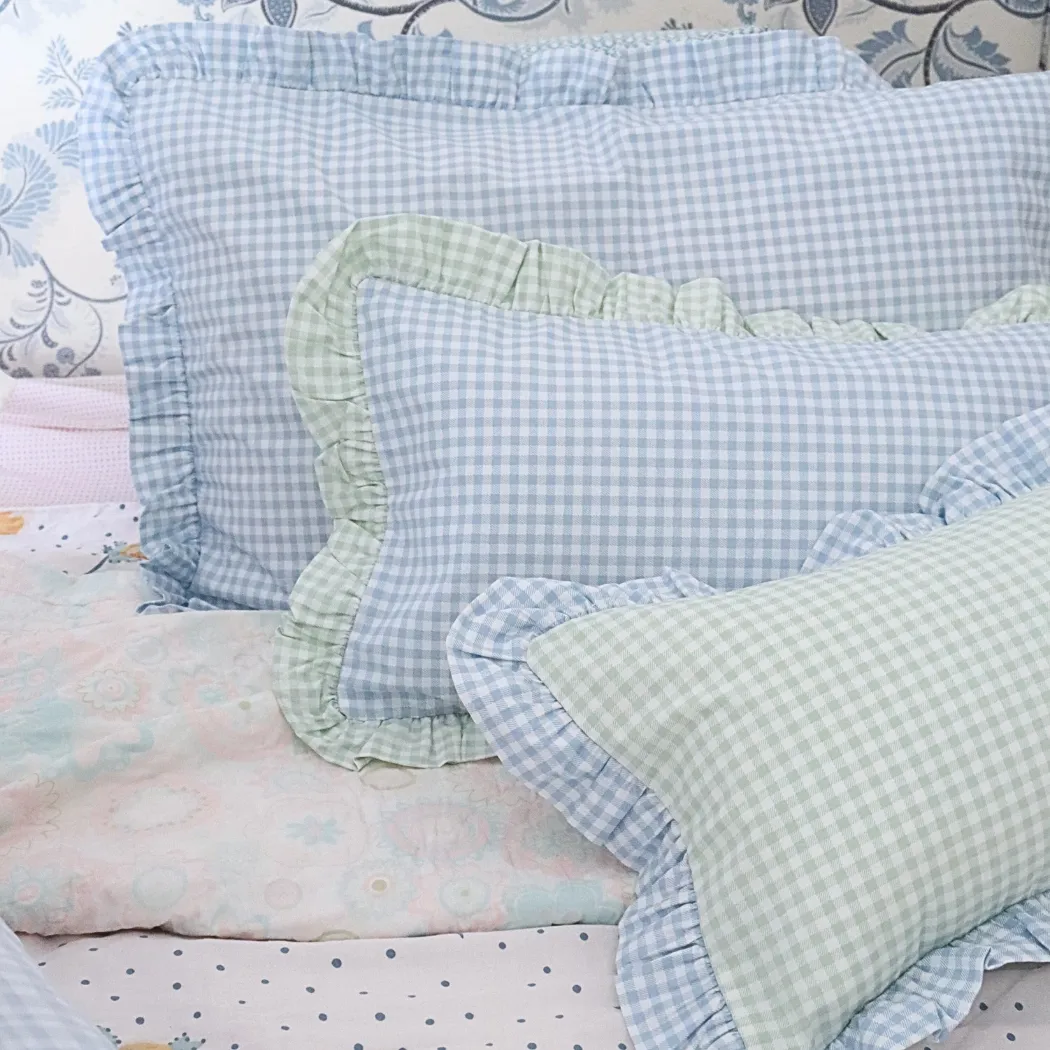 Blue gingham frilled cushion