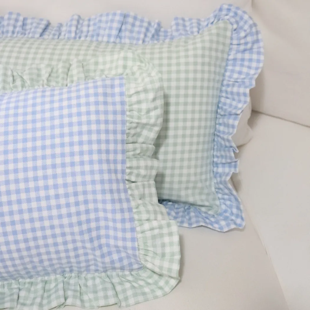 Blue gingham frilled cushion